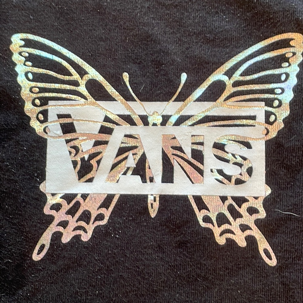 Holographic butterflies on front and elbows. Bought at Journey’s.